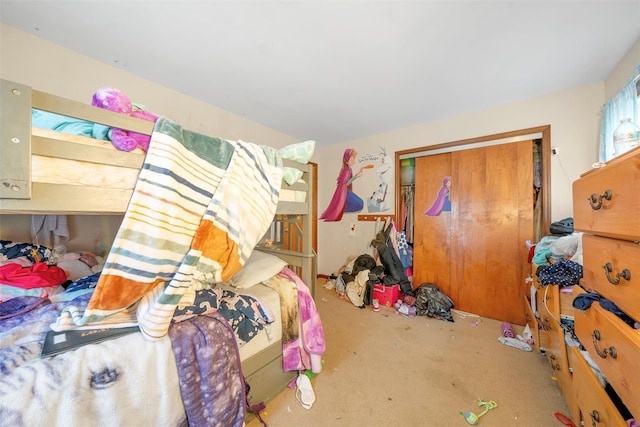 bedroom featuring a closet and carpet