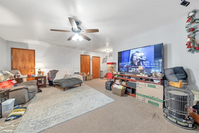 living room with carpet floors and ceiling fan