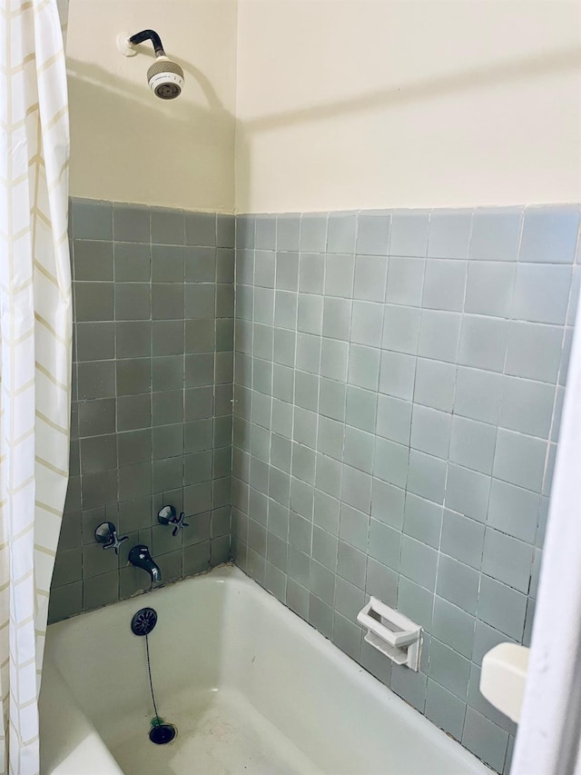 full bathroom with shower / bath combination with curtain