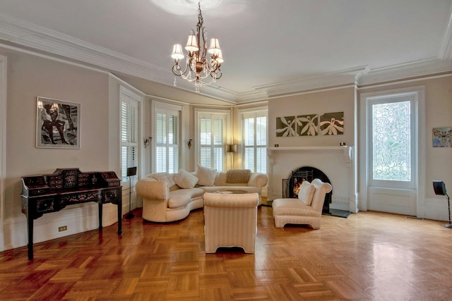 living room featuring crown molding, a notable chandelier, and a lit fireplace