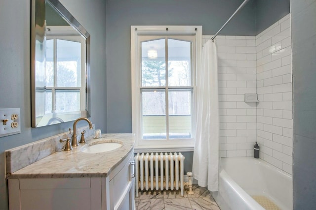 full bathroom with shower / bath combination with curtain, radiator, vanity, and marble finish floor