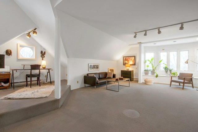 carpeted living room with track lighting, a baseboard heating unit, and lofted ceiling