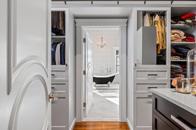 interior space with a chandelier and light wood-type flooring