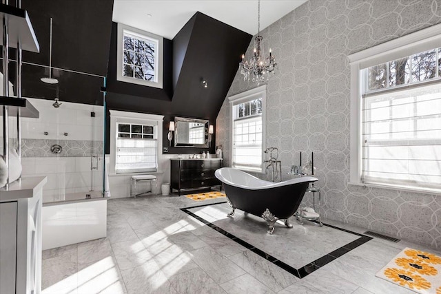 full bath featuring visible vents, a shower stall, wallpapered walls, a freestanding bath, and a chandelier