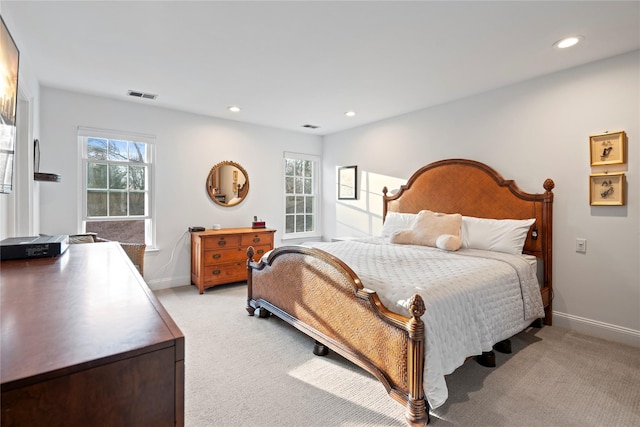 bedroom featuring recessed lighting, visible vents, baseboards, and light colored carpet