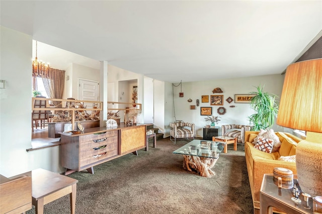 living room with a notable chandelier and carpet floors