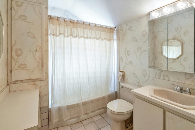 bathroom with wallpapered walls, toilet, vanity, and washtub / shower combination