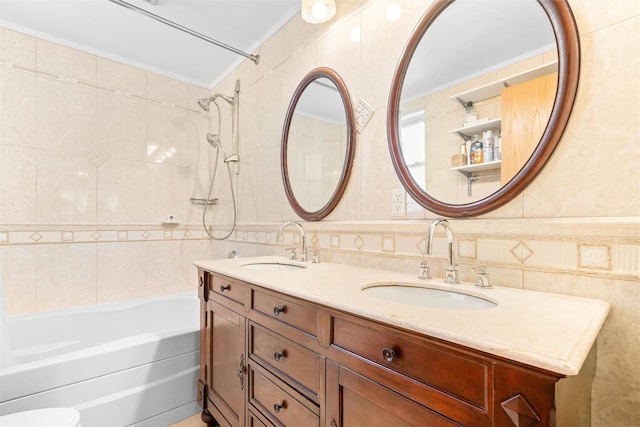 bathroom featuring washtub / shower combination, a sink, tile walls, and ornamental molding