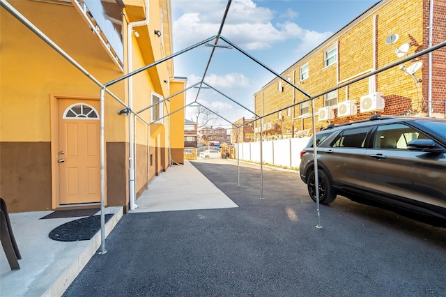 view of car parking with fence