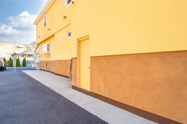 view of side of property featuring stucco siding