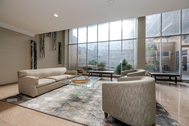 living room featuring recessed lighting, granite finish floor, a towering ceiling, floor to ceiling windows, and crown molding