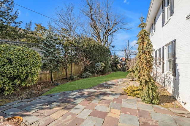 view of patio / terrace featuring fence