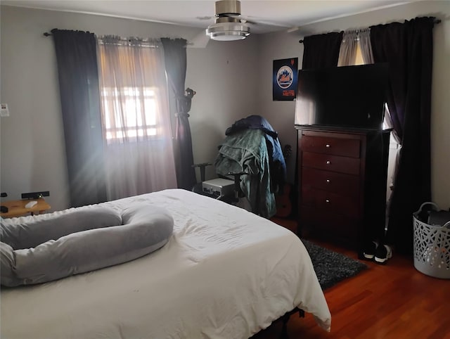 bedroom featuring wood finished floors