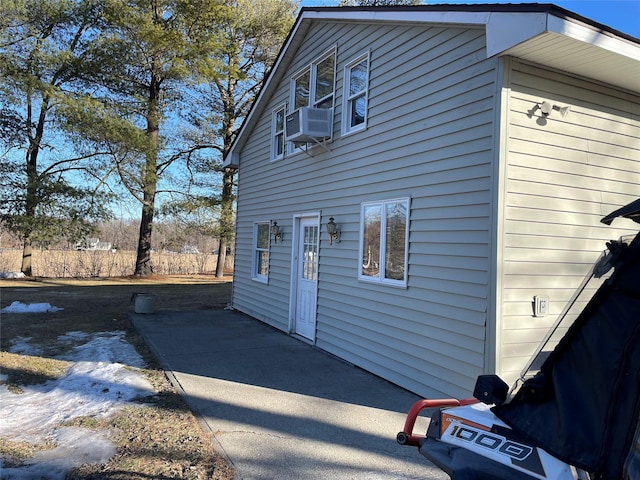 view of side of home with cooling unit