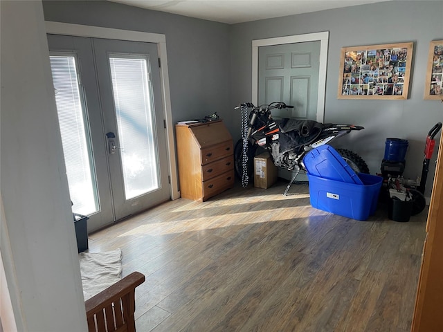 interior space with french doors and wood finished floors