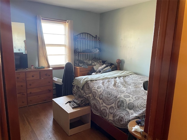 bedroom with wood finished floors