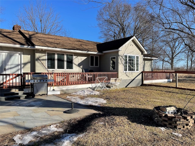 view of front of house with a patio area and a wooden deck