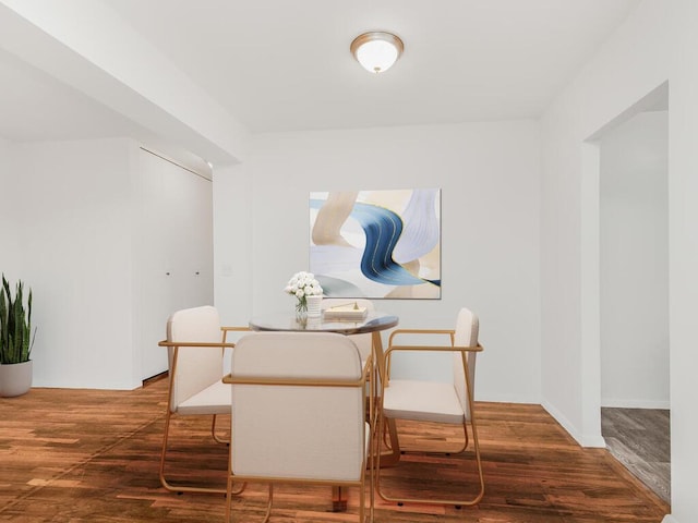 dining area with wood finished floors