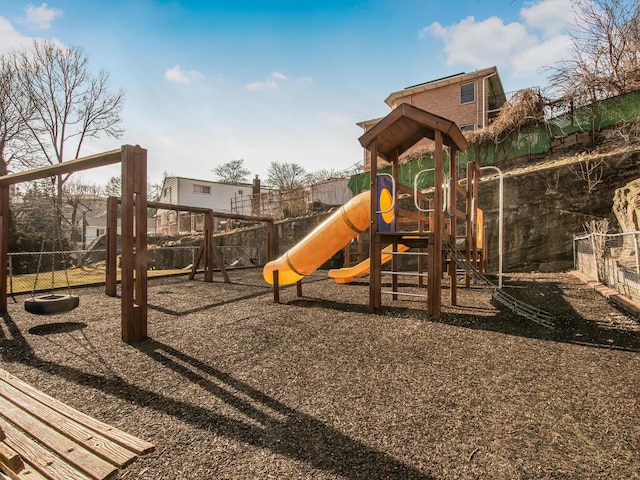 communal playground featuring fence