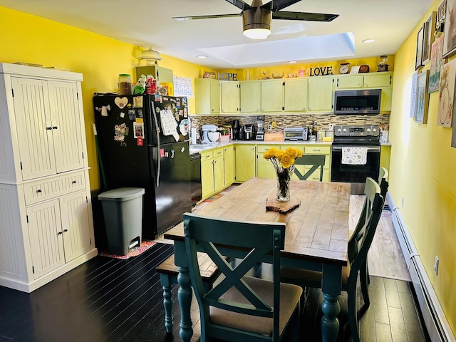 kitchen featuring dark wood-style floors, stainless steel appliances, tasteful backsplash, light countertops, and a baseboard heating unit