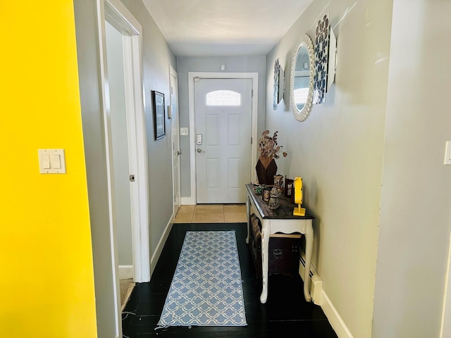 entryway featuring baseboards