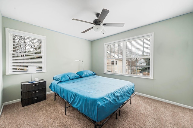 bedroom featuring a ceiling fan, carpet flooring, and baseboards