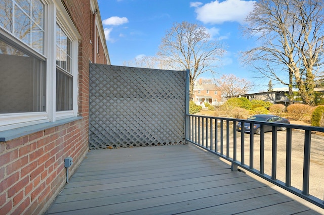 wooden deck with a residential view