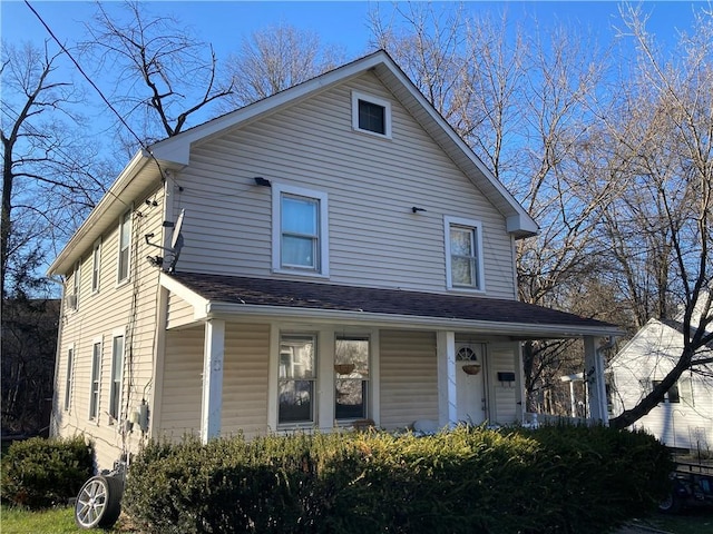 view of front of house with roof with shingles