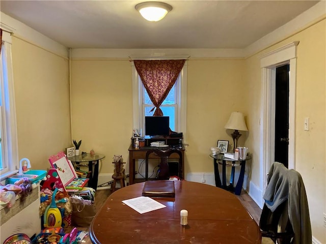 dining area featuring baseboards