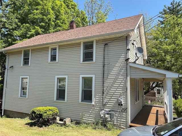 16 Fair St, Highland, NY 12528 - view of side of home featuring a chimney and roof with shingles