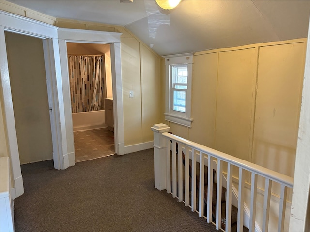 16 Fair St, Highland, NY 12528 - corridor featuring lofted ceiling, dark carpet, and an upstairs landing