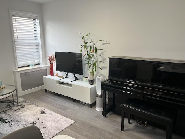 sitting room featuring light wood-style flooring