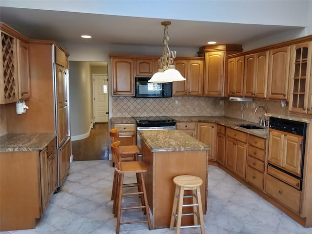 kitchen with black microwave, a kitchen island, a sink, decorative backsplash, and stainless steel electric range oven