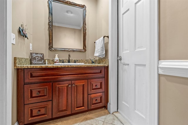 bathroom with ornamental molding, tile patterned flooring, and vanity