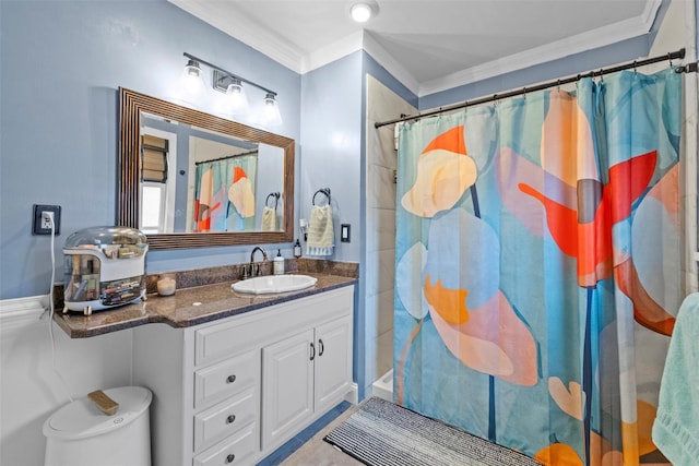 bathroom with ornamental molding, a shower with shower curtain, and vanity