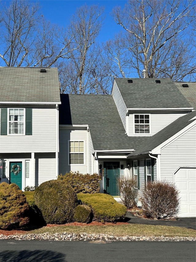 view of front of home with roof with shingles