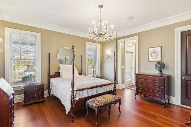 bedroom with dark wood-type flooring, multiple windows, and crown molding