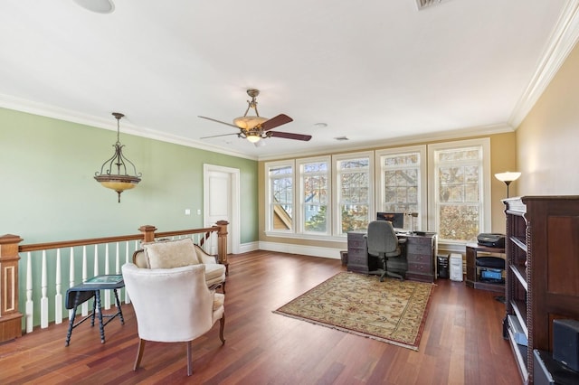 office featuring wood finished floors, a ceiling fan, visible vents, baseboards, and ornamental molding