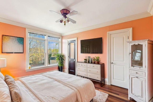 bedroom with a ceiling fan, dark wood-style flooring, and crown molding