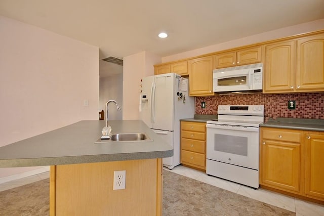 kitchen featuring a sink, visible vents, white appliances, and light brown cabinets