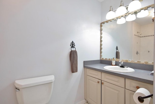 bathroom with a shower, toilet, and vanity