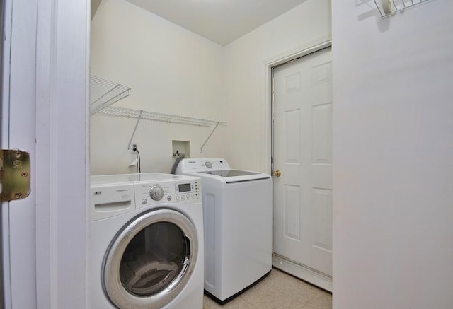 laundry area with laundry area, light floors, and independent washer and dryer