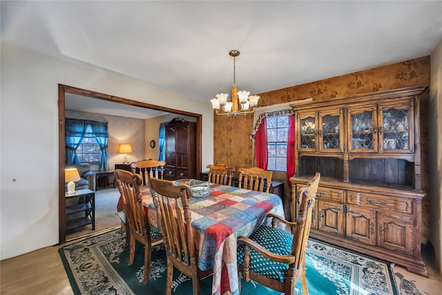 dining space with a notable chandelier