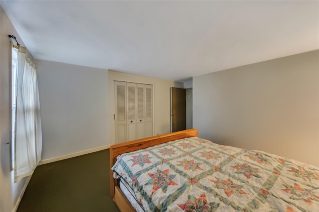 bedroom with carpet floors, a closet, and baseboards