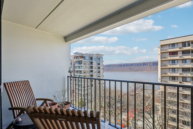 balcony featuring a water view