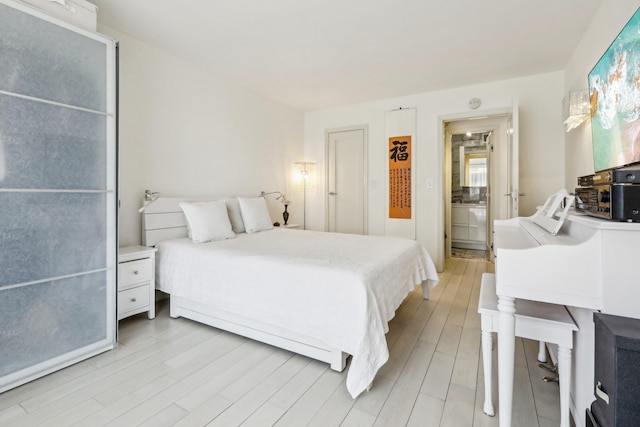 bedroom featuring light wood finished floors