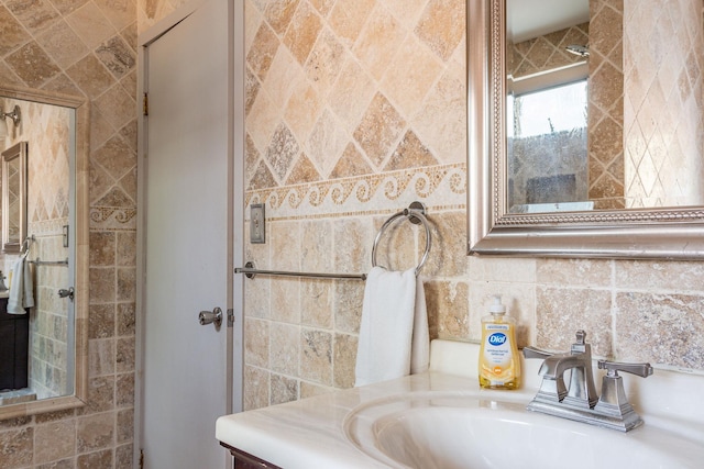 bathroom featuring backsplash, tile walls, and vanity