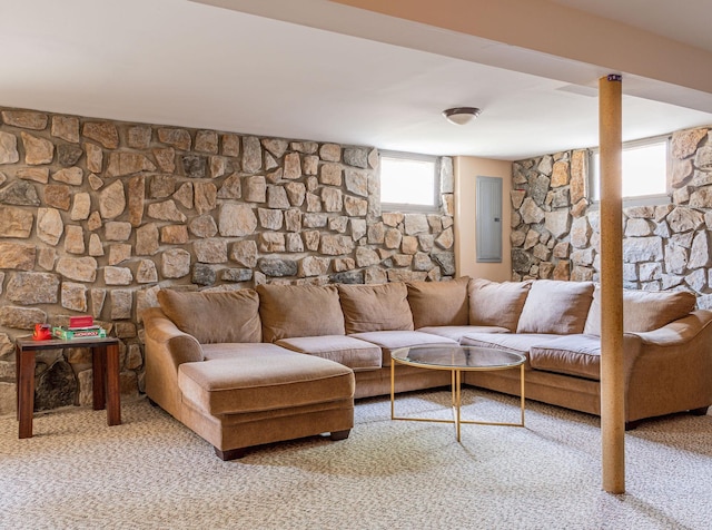 carpeted living room with electric panel