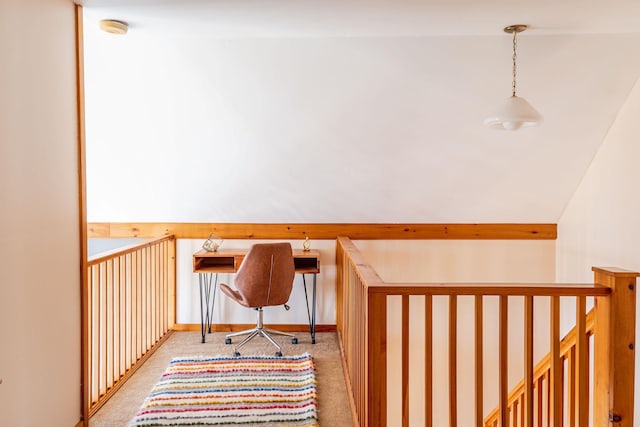 unfurnished office with lofted ceiling and carpet