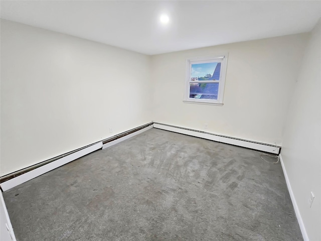 unfurnished room featuring carpet floors, a baseboard heating unit, and baseboards